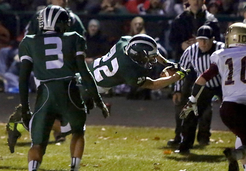 Jon Woods of Bonny Eagle dives into the end zone, a 10-yard run for the first touchdown of the game Friday night. The Scots went on to beat Thornton Academy 28-13 and will meet Cheverus for the Class A state title next Saturday at Fitzpatrick Stadium.