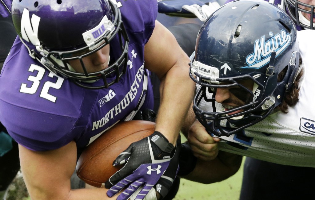 Troy Eastman, right, isn’t shy about getting into a foe’s face, as Northwestern running back Mike Trumpy can attest.