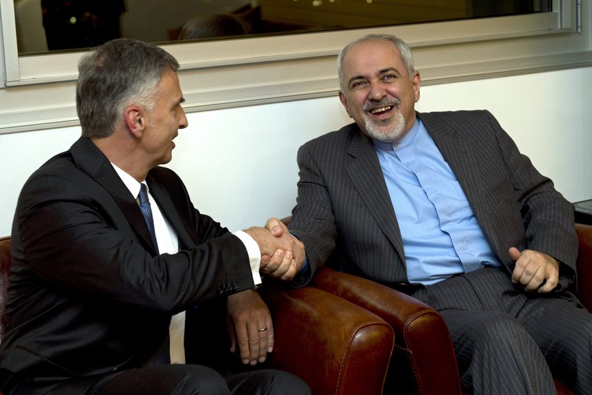 Switzerland’s Foreign Minister Didier Burkhalter, left, shakes hands with Iranian Foreign Minister Mohammad-Javad Zarif, during a meeting at the Intercontinental Hotel prior to talks about Iran’s nuclear program in Geneva, Switzerland, Saturday.