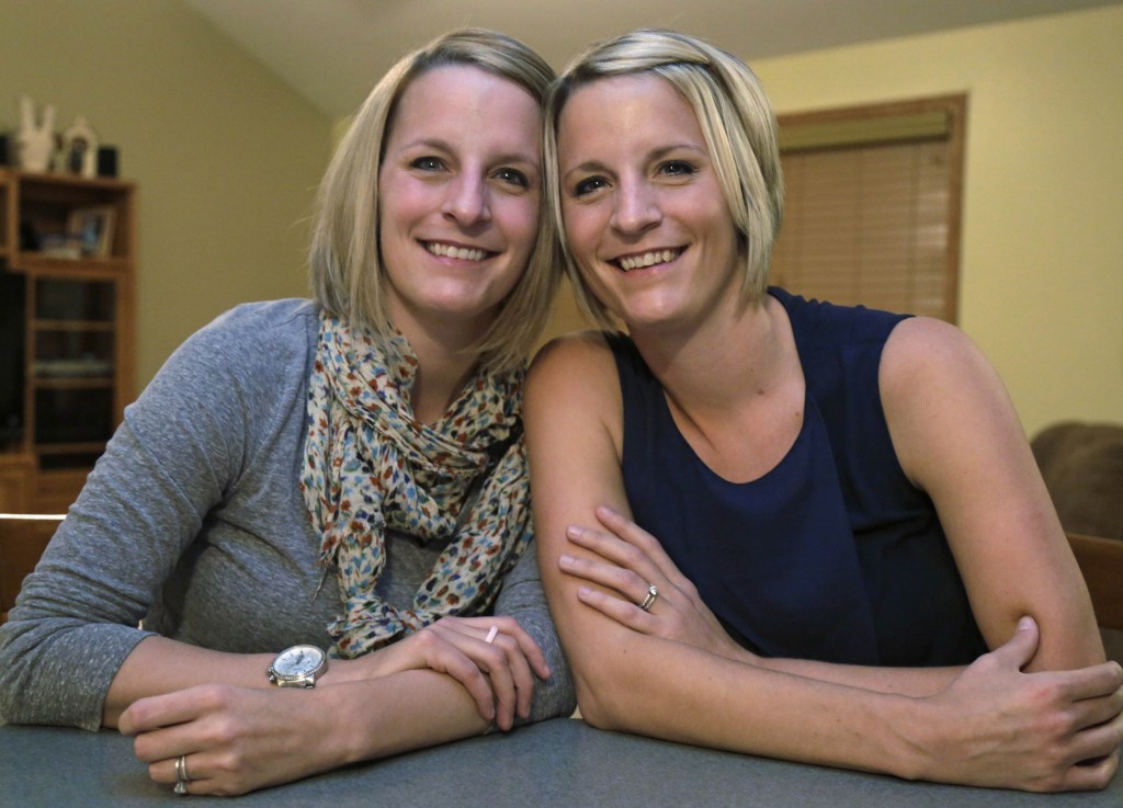 Identical twins Kristen Maurer, left, and Kelly McCarthy both have had breast cancer. Now the twins are sharing a medical rarity: Kristen donated skin and fat tissue for Kelly’s breast reconstruction surgery that was performed at the University of Chicago Medical Center on Tuesday.