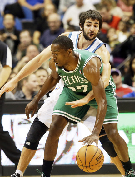 Jordan Crawford of the Boston Celtics attempts to keep the ball away from Ricky Rubio of the Minnesota Timberwolves during Minnesota’s 106-88 victory Saturday night.