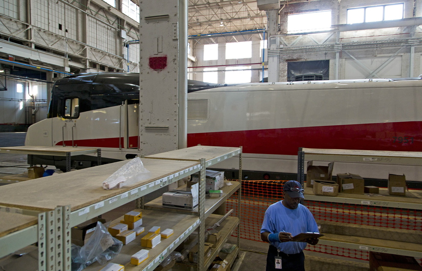 Corey Stacy, an inventory control worker, performs his daily duties last month at the Talgo plant in Milwaukee, where high-speed rail cars now sit dormant.