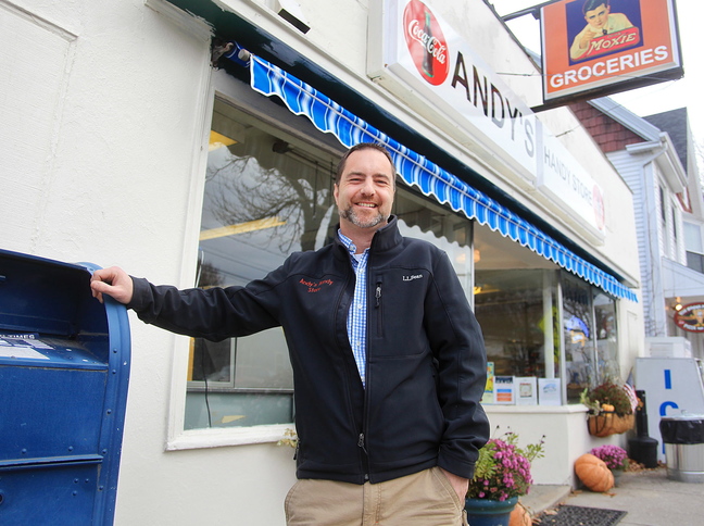 Matt Williams stands in front of his Andy’s Handy Store in Yarmouth. His purchase of the shop in July triggered the loss of the contract to offer full postal services.