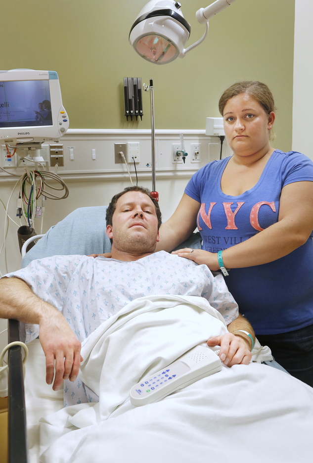 Casey Larcombe and his fiancee, Kathryn LePage, await results of X-rays on Larcombe’s spine at Maine Medical Center on Nov. 7. A reader wonders how anyone can believe that the driver who allegedly triggered a crash involving Larcombe on Nov. 6 was unaware that she’d hit his car.