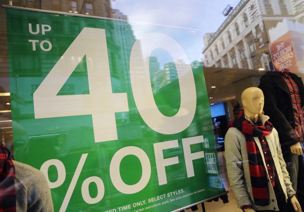 A pre-holiday sale sign is displayed at a Gap store in New York earlier this week. A retail trade group expects holiday sales to increase 3.9 percent this year.