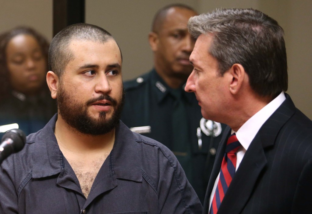 George Zimmerman, acquitted in the high-profile killing of unarmed black teenager Trayvon Martin, faces his defense counsel Jeff Dowdy in court Tuesday, Nov. 19, 2013, in Sanford, Fla., during his hearing on charges including aggravated assault stemming from a fight with his girlfriend.