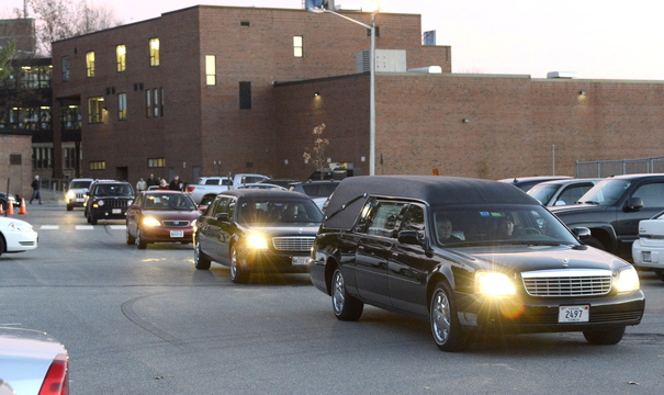 A motorcade departs after the memorial service for Brendan Conway, a former Deering High athlete who died Thursday while playing basketball.