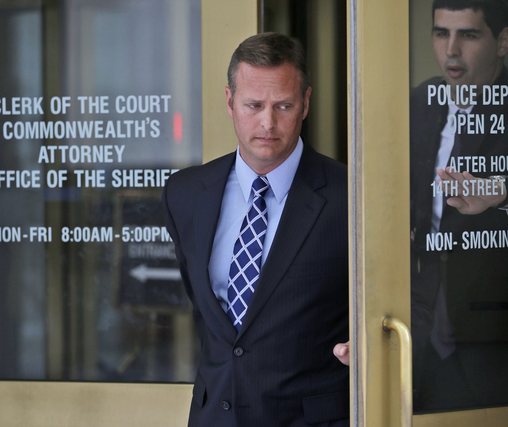 Lt. Col. Jeffrey Krusinski, who led the Air Force’s Sexual Assault Prevention and Response unit, leaves the Arlington County, Va. General District Court in this July 18, 2013, photo.