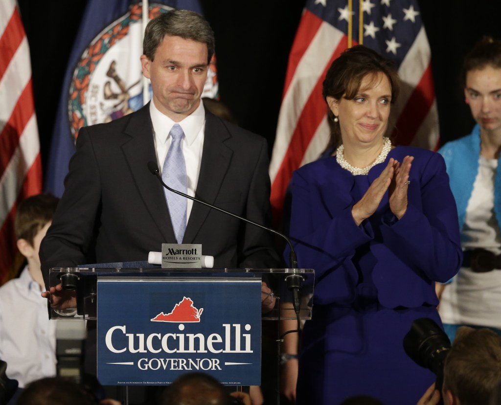 Republican gubernatorial candidate, Virginia Attorney General Ken Cuccinelli delivers his concession speech with his wife, Teiro, during a rally in Richmond, Va., Tuesday, Nov. 5, 2013. Cuccinelli was defeated by Democrat Terry McAuliffe.