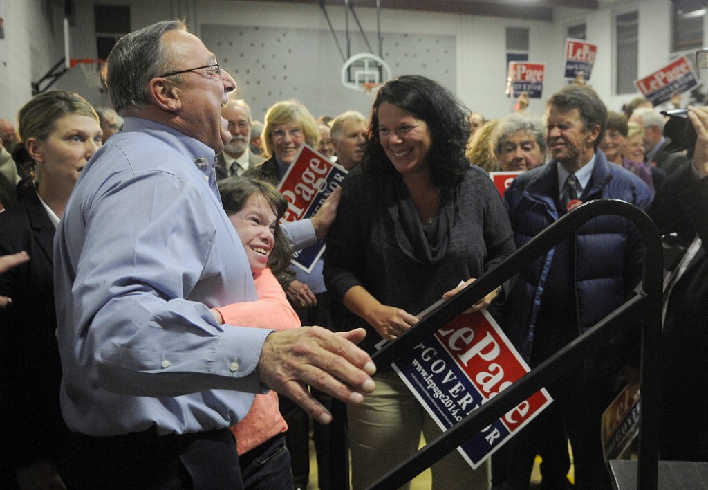 Gov. Paul LePage gets a hug from a child after officially kicking off his re-election campaign Tuesday during a rally in Augusta attended by about 200 supporters.
