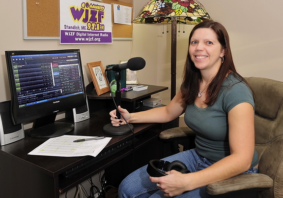 Kristie Doyle runs a community radio station out of her house in Raymond in memory of her late uncle, who produced shows from the chair in which she’s sitting.