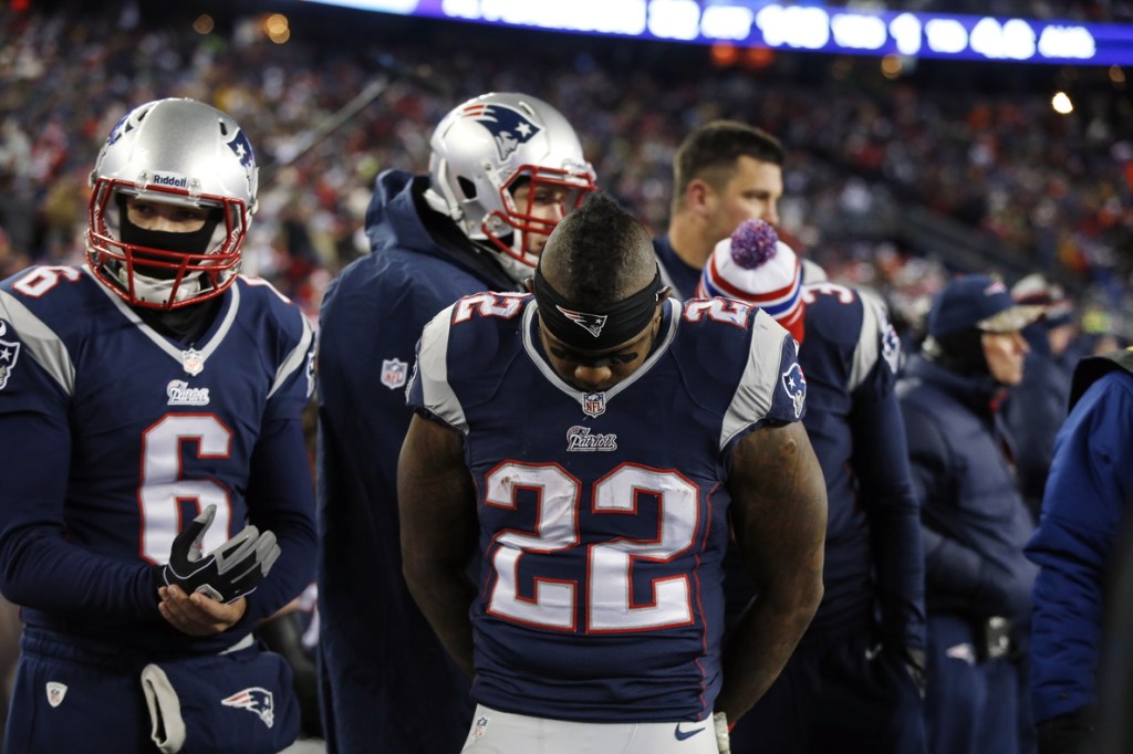 Patriots running back Stevan Ridley (22) stands on the sideline after fumbling in the first quarter against the Denver Broncos on Sunday in Foxborough, Mass.