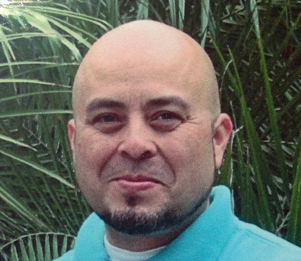 This June, 2013 photo released by the Hernandez family Saturday, Nov. 2, 2013, shows Transportation Security Administration officer Gerardo Hernandez. Hernandez, 39, was shot to death and several others wounded by a gunman who went on a shooting rampage in Terminal 3 at Los Angeles International Airport Friday
