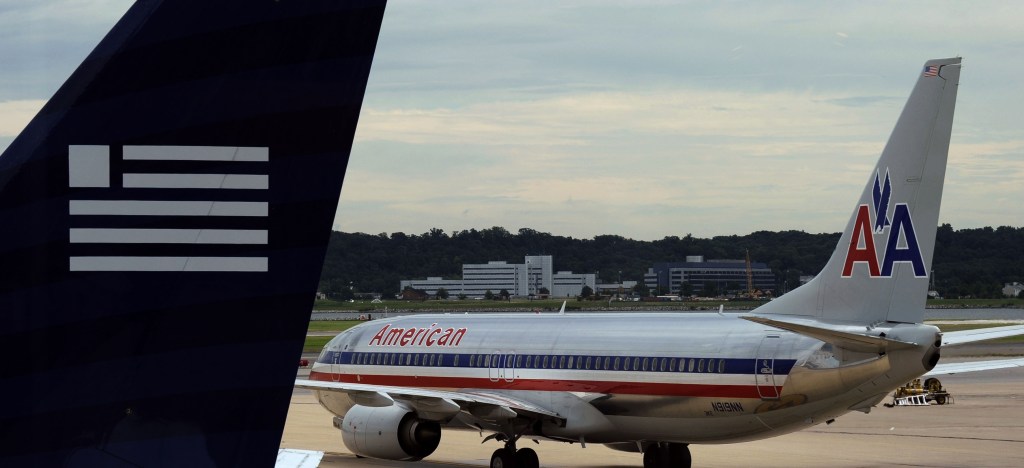 The federal government has a Nov. 25 trial date for a lawsuit aimed at preventing a merger between American Airlines and US Airways.