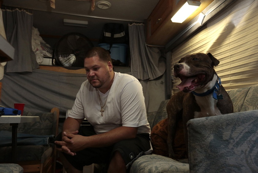 Steven Cintron parks his RV outside a hotel, which he pays to connect to electricity, in Brooklyn.