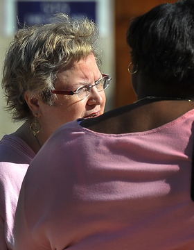 Martha Rigsby, left, speaks with attorney Vickey Wright-Smith as they leave court Wednesday.