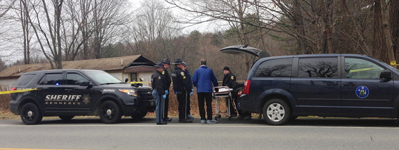 Officials prepare to remove the body of a man found Friday morning in Vassalboro.