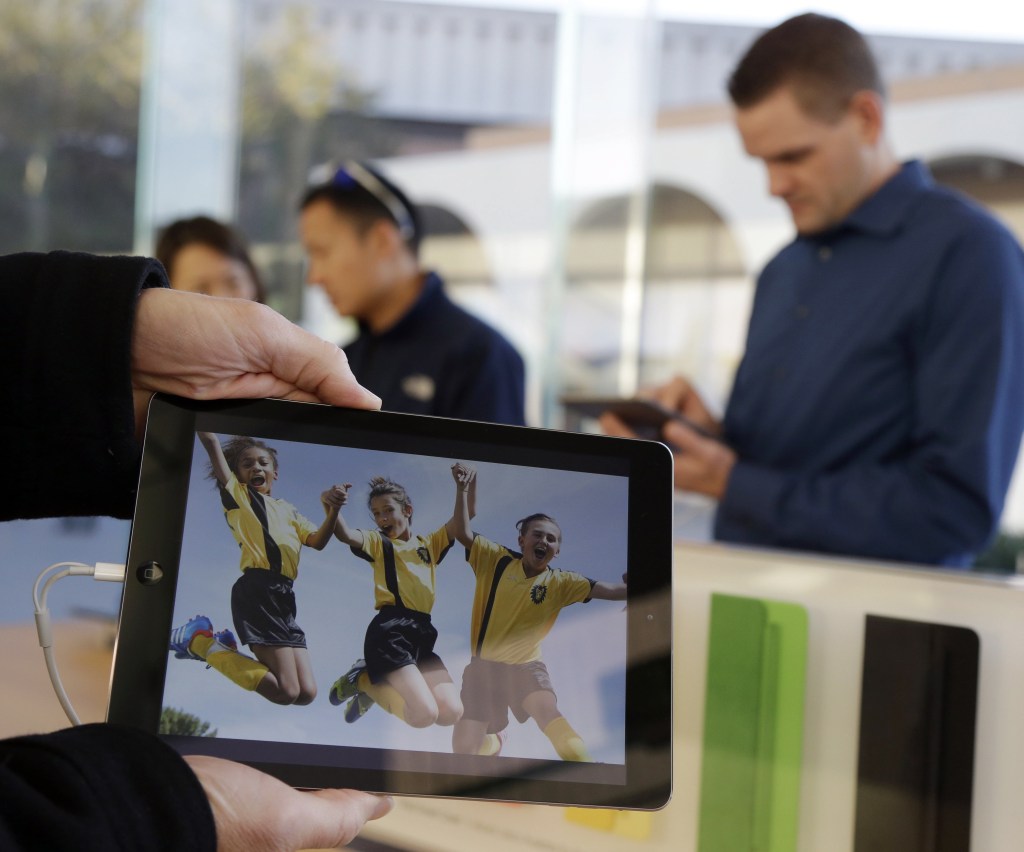 The new iPad Air, displayed Friday in Stanford, Calif., is lighter and faster-running and is priced at $499.