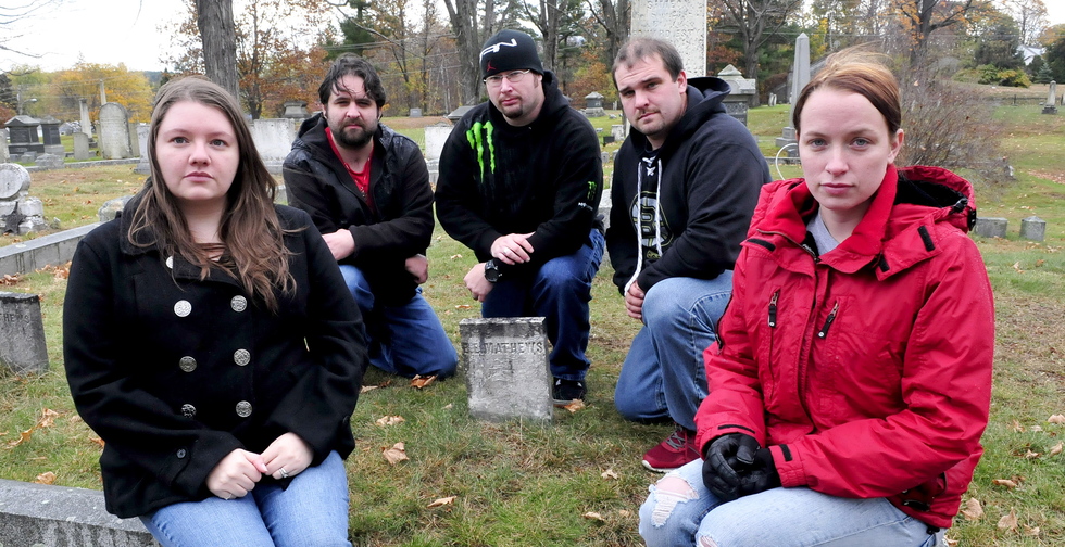 Members of Paranormal Research and Extermination assemble at the Edward E. Mathews gravesite at Pine Grove Cemetery in Waterville recently. From left are Naomi and Kris Robinson, Jim Easler, Chris Clarke and Allie Turner.