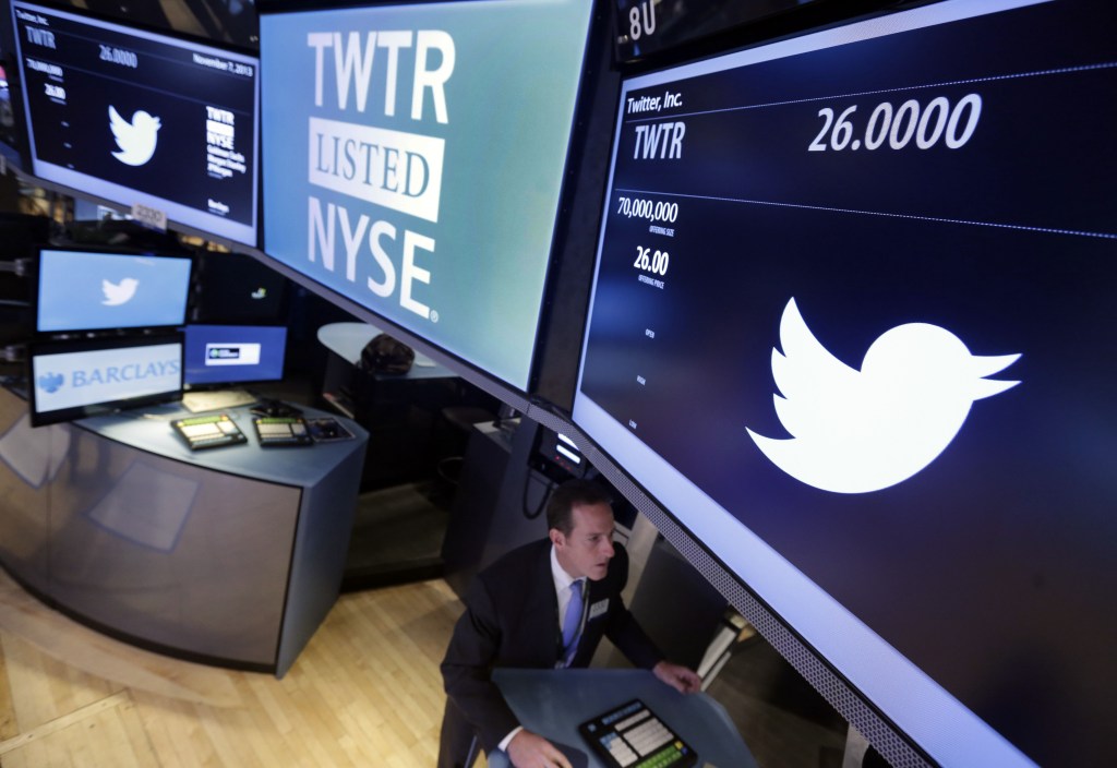 Specialist Glenn Carell, who handled the Twitter IPO, works at his post on the floor of the New York Stock Exchange on Thursday.