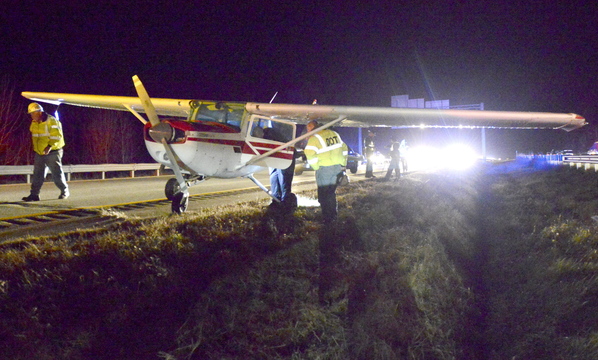 State police and Maine DOT officials look over a small plane that made an emergency landing in the southbound lane of I-295 in Falmouth. “It was amazing. He landed in the middle of the road. It was luck. I don’t know any other way to put it,” a trooper said.