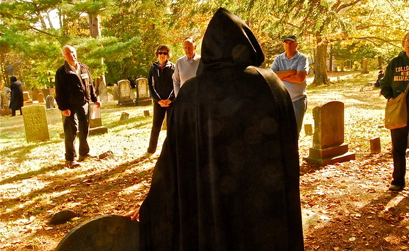 Visitors participate in a recent cemetery walk sponsored by Tate House Museum. The tour featured eight specters from the city’s past who talked about life in the 1700s. Among the specters was Mary Tate, the family matriarch.
