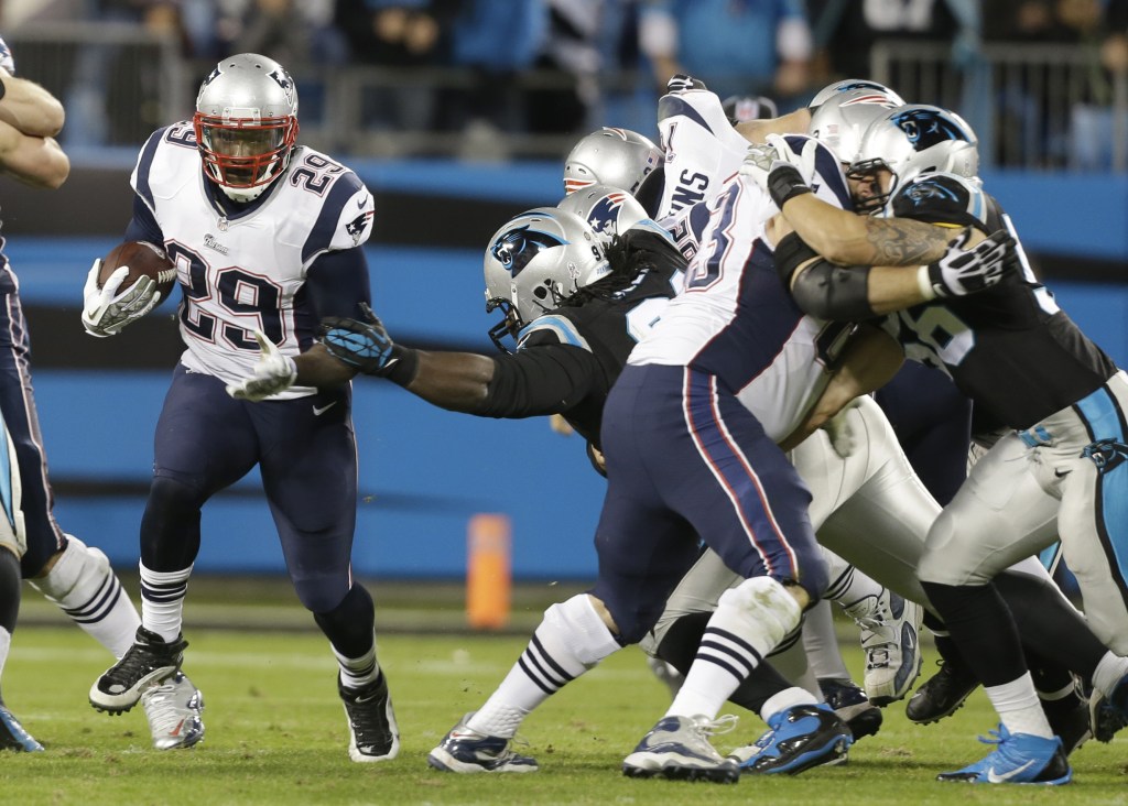 New England Patriots' LeGarrette Blount (29) runs past the Carolina Panthers during the second half Monday night's game in Charlotte, N.C.