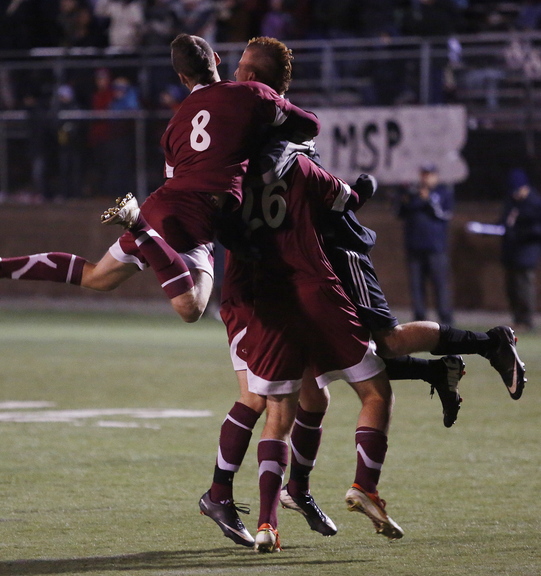 Greely High players celebrate a 1-0 win over Camden Hills on Saturday in the Class B boys’ soccer state championship game at Hampden Academy.