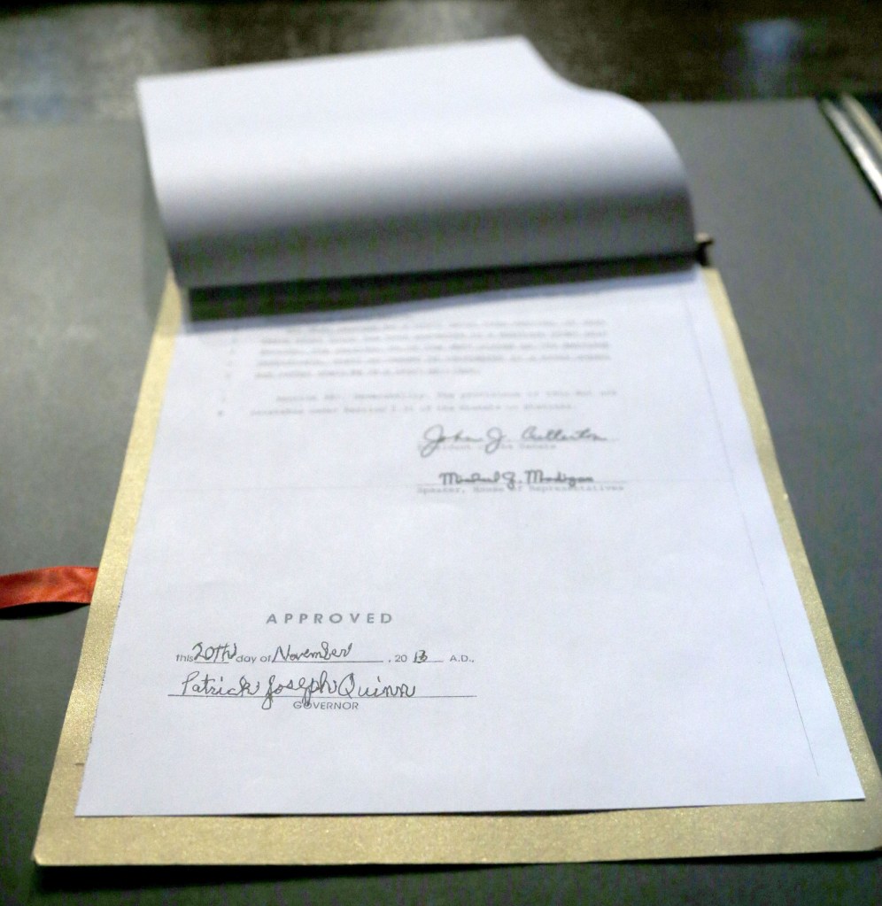 The signature of Illinois Gov. Patrick Joseph Quinn is affixed to the Religious Freedom and Marriage Fairness Act into law during ceremonies on the campus of the University of Illinois Chicago Wednesday, Nov. 20, 2013, in Chicago. Illinois becomes the 16th state to legalize same-sex marriage.