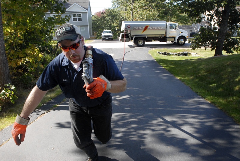 Keith Franklin of Cash Energy delivers heating oil to a home in Old Orchard Beach. Because the federal government is unable to pass a budget, the Low Income Heating Assistance Program, known as LIHEAP, keeps the people who depend on it in constant suspense.