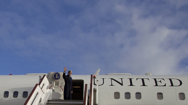 Secretary of State John Kerry turns and waves as he boards his aircraft at London's Stansted Airport, Monday, Nov. 25, 2013, en route to Washington. While in London Kerry had meetings with Libyan's Prime Minister Ali Zeidan and British Foreign Secretary William Hague. Prior to London, Kerry was in in Geneva, Switzerland, for the Iran nuclear talks. European Union sanctions against Iran could be eased as soon as December, officials said Monday, after a potentially history-shaping deal that gives Tehran six months to increase access to its nuclear sites in exchange for keeping the core components of its uranium program.