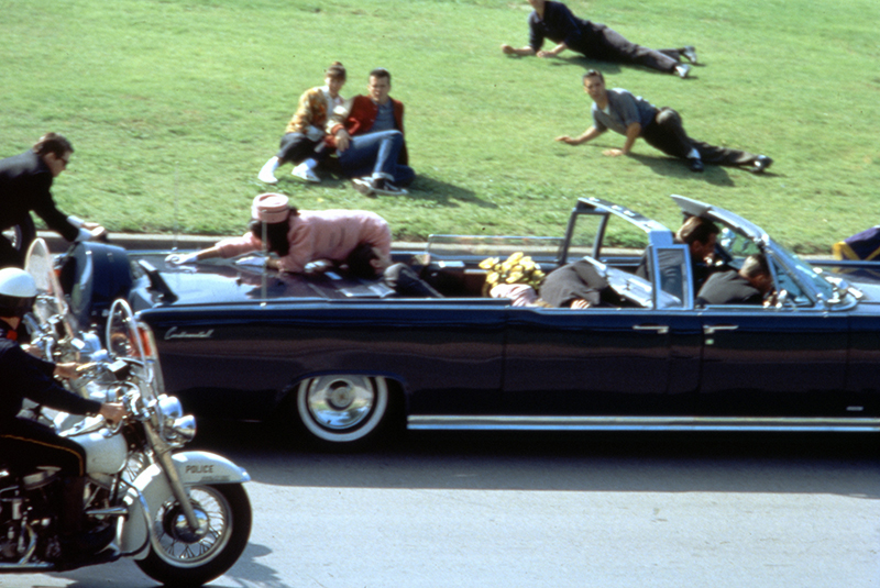 This image provided by Warner Bros. from Oliver Stone's 1991 movie "JFK" shows a recreation of the assassination of U.S. President John F. Kennedy in Dallas. "This murder in broad daylight ... Everything changed," says Stone, the Baby Boomer director who served in Vietnam and made a movie about it before turning his critical lens on the Kennedy assassination.