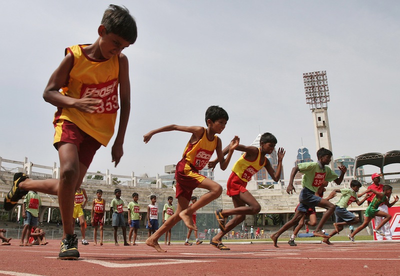 In this May 13, 2007 file photo, boys participate in a 100-meter race during the two-day World Athletics Day meet in Bangalore, India. An analysis of studies on 250 million children around the world finds they don't run as fast or as far as their parents did when they were young. Research featured at the American Heart Association's annual conference Tuesday showed that on average, children 9 to 17 take 90 seconds longer to run a mile than their counterparts did 30 years ago.