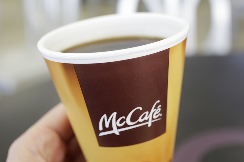 In this Thursday, Feb. 14, 2013 file photo, coffee served in a foam cup is held for a photographer, at a McDonald's restaurant in New York. McDonald's wants to be a bigger player in the global coffee business. The world's biggest hamburger chain on Thursday, Nov. 14, 2013, highlighted beverages as one of its key growth opportunities at a daylong a daylong presentation for investors.