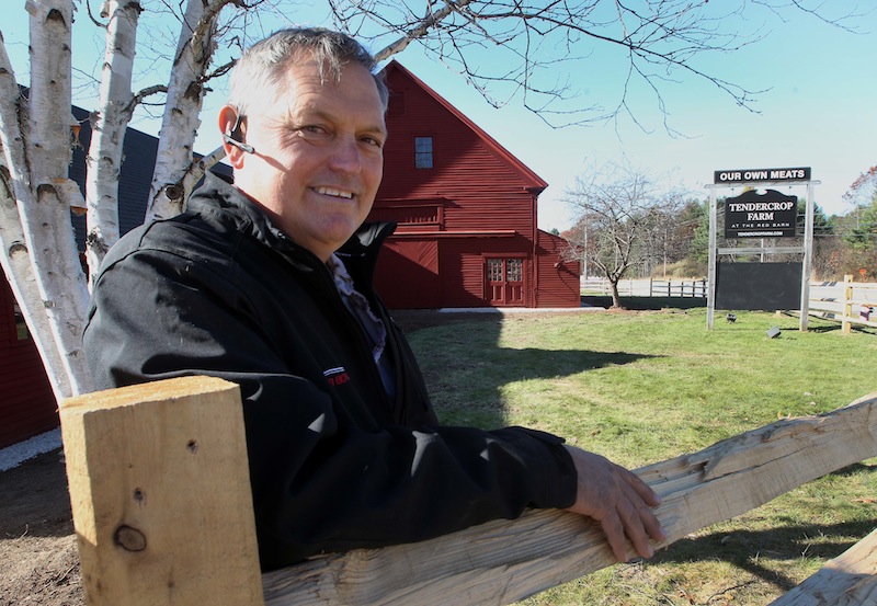 Matt Kozazcki poses in front of the old red barn at the former Tuttle Farm in Dover, N.H., on Tuesday Nov. 5, 2013. Kozazcki recently purchased the 135-acre farm from the Tuttle family. The farm, one of America's oldest continuously operated family farms, began in 1632 when John Tuttle arrived from England, using a small land grant from King Charles I to start his enterprise.