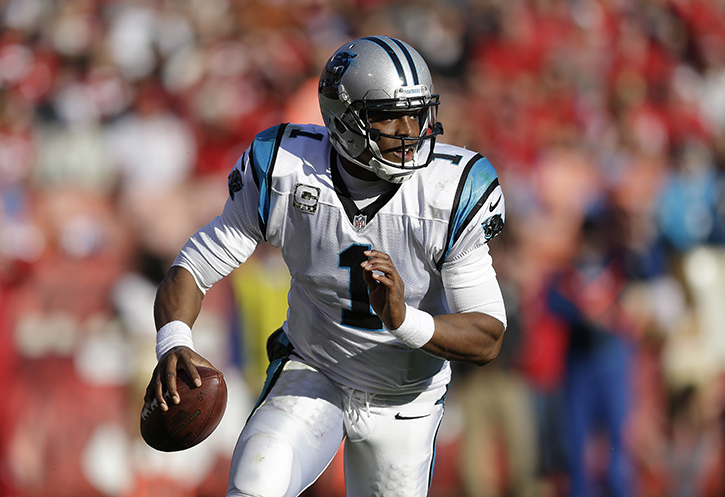 Carolina Panthers quarterback Cam Newton rolls out against the San Francisco 49ers during the third quarter of a game in San Francisco Sunday.