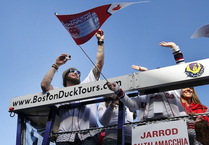 Boston Red Sox catcher Jarrod Saltalamacchia takes pictures as he rides in a duck boat during a rolling rally in Boston, Saturday, Nov. 2, 2013 to celebrate their World Series championship. What to do with Saltalamacchia and the catcher's position is one of the major questions facing the Red Sox this offseason. Saltalamacchia has a major offense slump in the postseason and was replaced during the World Series.