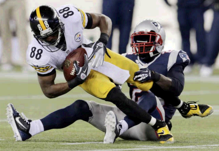 New England Patriots cornerback Kyle Arrington, right, tackles Pittsburgh Steelers wide receiver Emmanuel Sanders in the fourth quarter of Sunday's game in Foxborough, Mass. The Patriots won 55-31.