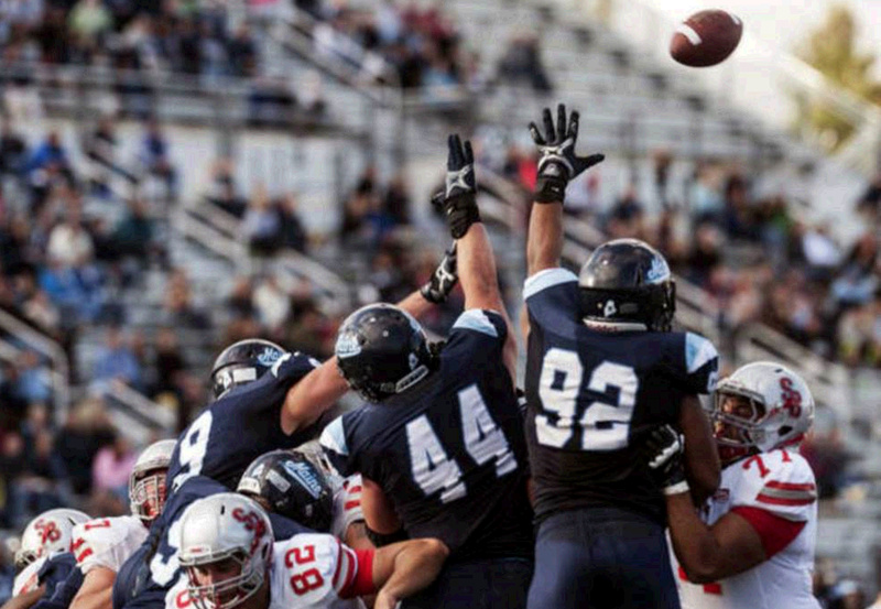 Maine defensive players Michael Cole (9), Patrick Rickard (44) and Trevor Bates (92) attempt to block a Stony Brook field goal in the second half of Saturday's game in Orono.