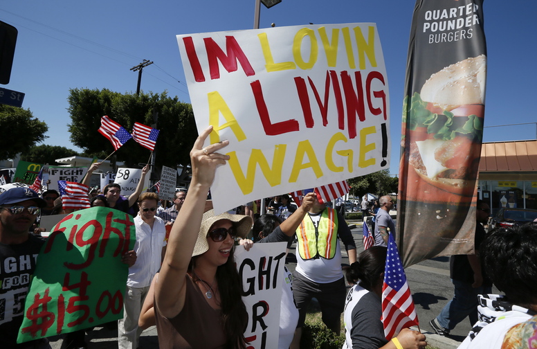 Workers and their supporters protest outside McDonald's in Los Angeles as part of a nationwide strike by fast-food workers in August to call for wages of $15 an hour.