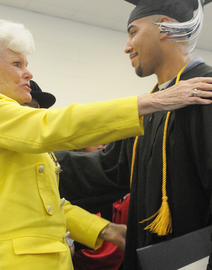 Maine State Prison inmate Sergio Hairston hugs philanthropist Doris Buffett after receiving a diploma from the University of Maine at Augusta during a ceremony Nov. 4 at the state correctional institution in Warren. Buffett, the sister of Warren Buffett, founded the Sunshine Lady Foundation, which supports educating inmates across the United States.