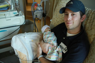 Nick Bowie-Haskell holds his son Charlie in the hospital. Charlie died in December from an incurable cancer, 17 days after he was born.