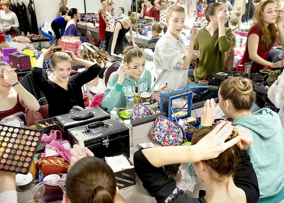 Dancers do their hair and makeup as they prepare to perform Maine State Ballet’s “The Nutcracker” at Merrill Auditorium on Sunday afternoon.