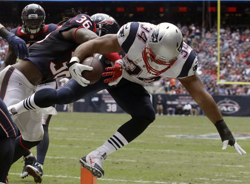 New England Patriots’ Shane Vereen (34) is knocked out of bounds at the 1-yard line by Houston Texans’ D.J. Swearinger (36) during the third quarter Sunday in Houston.