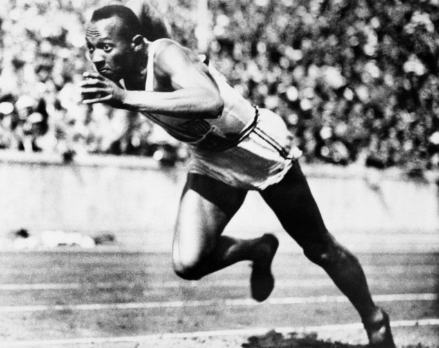 In this Aug. 14, 1936, file photo, Jesse Owens competes in one of the heats of the 200-meter run at the 1936 Olympic Games in Berlin.