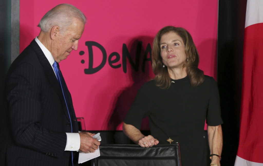 U.S. Vice President Joe Biden talks with U.S. Ambassador to Japan Caroline Kennedy during his tour to DeNA Co. Ltd, a global Internet company providing Web services for mobile devices and PCs, in Tokyo on Tuesday.