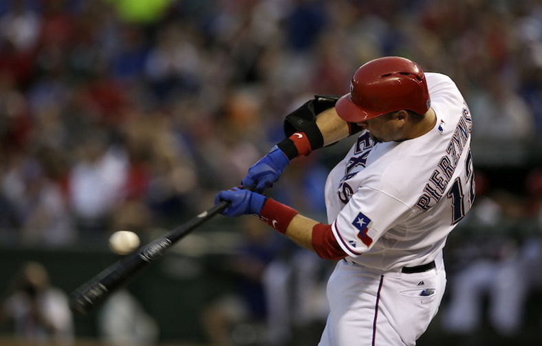 Rangers’ A.J. Pierzynski swings at a pitch in the first inning against the Oakland A's, in Arlington, Texas, on Sept. 13. A person with knowledge of the negotiations says free-agent catcher Pierzynski is closing in on a one-year contract with the Boston Red Sox.