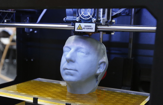 A 3-D printer, such as this one fabricating a likeness of a head, can also be used to produce a working plastic gun that can slip past metal detectors and X-ray machines.