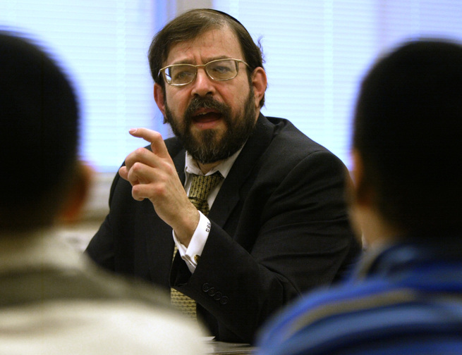 Rabbi S. Binyomin Ginsberg is shown in a 2003 photo. The Supreme Court indicated Tuesday that it won’t offer much help to frequent fliers who want to sue when airlines revoke their miles or their memberships. The justices heard the case of Ginsberg, who was stripped of his top-level “platinum elite” status in Northwest’s WorldPerks program because the airline said he complained too much.
