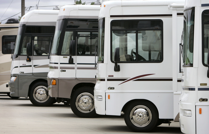Winnebago motor homes are shown on a lot in Jefferson, Iowa. Led by sales growth for towable RVs and pricier stand-alone motor homes, recreational vehicle makers expect to ship more than 300,000 units to dealers in 2013 for the first time since the economic downturn.